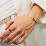 Thin Gold Ring, Striated Texture and Faceted Glass