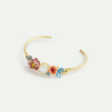 Bangle Bracelet Adorned with Pink and Blue Flower and Mother of Pearl Round Stone