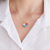 Pendant Necklace with Round Blue Stone and Poppie