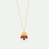 Gold Pendant Necklace with Cosmos and Red Stones