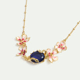 Bracelet with Blue Faceted Stone, Gold Snake and Mallow Flowers